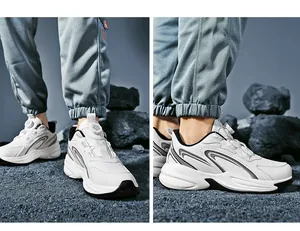 Detail of white chunky sneakers featuring a dial lacing system and shock-absorbing sole