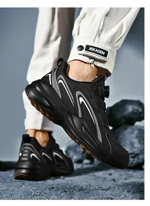 Detail of athletic shoes featuring rotary dial closure system and wavy side patterns