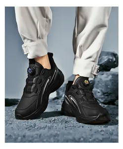 Detail of black sports shoes featuring a quick-release rotating dial lacing system