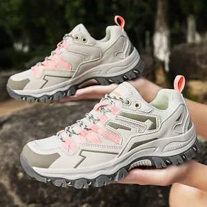 Women's outdoor hiking shoes in beige mesh with pink accents and non-slip rubber soles