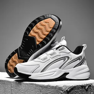 White and orange sports sneakers with rotary buckle system and anti-slip rubber sole