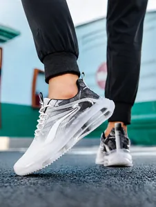 On-foot view of grey mesh breathable sneakers featuring a full-length transparent air cushion
