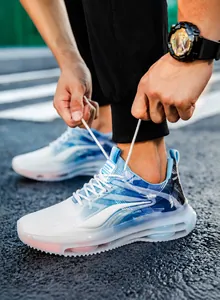 Detail of blue gradient mesh sports sneakers with thick translucent cushioned soles