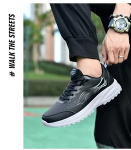 Baskets homme en cuir noir avec motif flamme gris et semelle blanche, style urbain