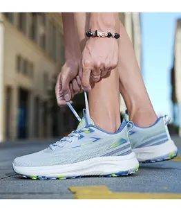 Close-up of lightweight breathable running shoes with gradient mesh and running text