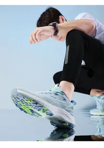 Close-up of blue mesh running shoe with neon green accents and white cushioned sole