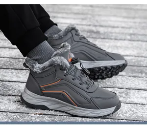 Macro detail of men winter boots with warm gray faux fur lining and thick non-slip soles