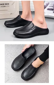 Detail of black leather mule shoes with manual stitching and non-slip rubber soles