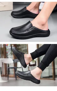 Detail of glossy black leather mule shoes with fine stitching and slip-on casual design