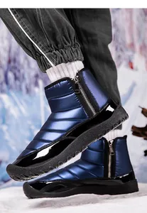 Detail of waterproof quilted nylon upper and side zipper on blue men's snow boots