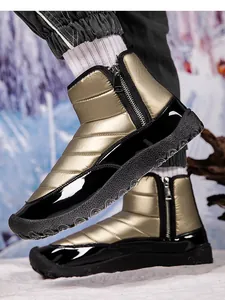 Detail of champagne gold waterproof snow boot with side zippers and non-slip rubber sole