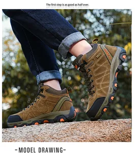 Action shot of high-top brown hiking boots worn by a model on rocky terrain