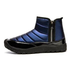 Close-up of waterproof navy metallic snow boots featuring side zippers and anti-slip rubber soles