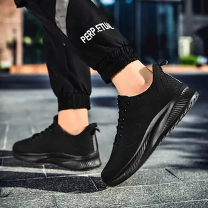 Detail of black breathable knit running shoe with textured anti-slip sole and heel pull tab
