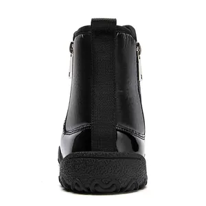 Rear view of waterproof winter boots featuring dual zippers and glossy patent leather trim