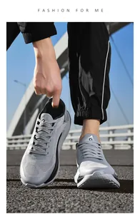 Detail of grey mesh running shoe with thick cushioned sole and breathable upper material