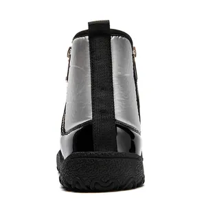 Rear view of silver metallic snow boots with glossy black panels and thick rubber soles