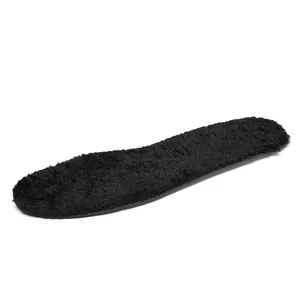 Detail of thick black faux fur insole providing thermal insulation for winter boots