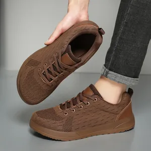 Detail of breathable brown mesh upper and reinforced heel on these men's running shoes