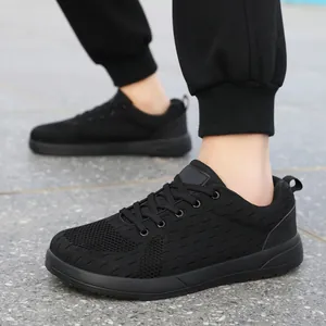 Rear side view of black breathable mesh running sneakers with modern geometric rubber sole