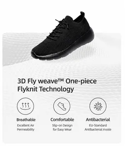 Détail du tissu respirant 3D Fly weave et design sans lacets de la basket de course noire