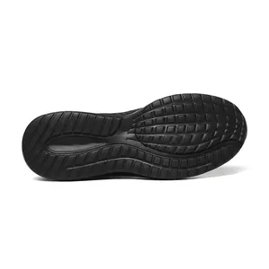 Bottom view of black lightweight running shoes featuring non-slip rubber grip pattern