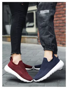 Detailed close-up of 3D knitted breathable upper on slip-on running shoes in red and blue