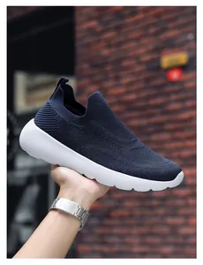 Close-up of navy blue 3D breathable knit upper and white cushioned sole on sneakers