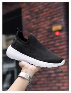 Detail of hand-held 3D breathable knit running shoe with thick white cushioned sole
