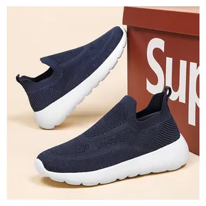 Macro detail of breathable navy blue 3D knit sneakers with thick white cushioned soles