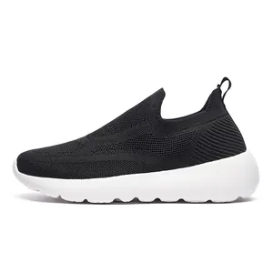 Detail view of black 3D knit breathable slip-on sneakers with a cushioned white foam sole
