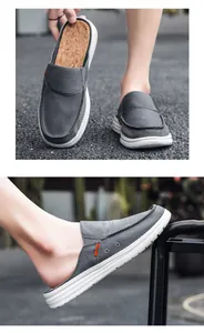 Detail of grey canvas mule shoes with orange fashion label and cork texture insole