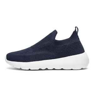 Detail of navy blue 3D knit upper and white cushioned sole of the slip-on sneaker