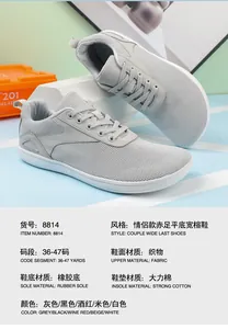 Detailed view of gray barefoot wide-toe shoe showing breathable mesh and rubber sole specs