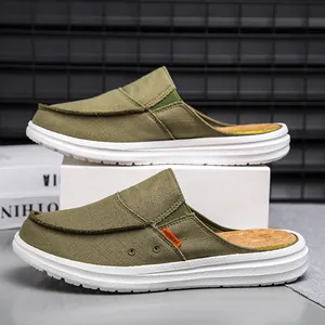 Men's army green canvas mules with thick white rubber soles and fashion labels