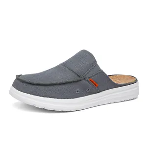 Men's grey canvas mule sneakers with cork texture insole and thick white rubber sole