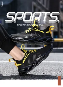 Detail view of black breathable mesh sneakers with yellow laces and hollow cushioning sole