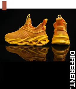 Detail of yellow breathable mesh sneakers with pink stripes and hollow wave soles