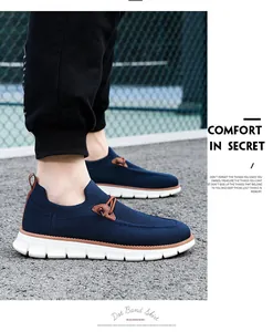 On-foot view of breathable navy knit slip-on loafers with durable white cushioned soles