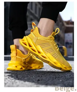 Close-up of vibrant yellow breathable mesh sneakers with blade-style hollow out sole