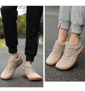 Detail view of breathable mesh texture and non-slip rubber sole on khaki casual sneakers
