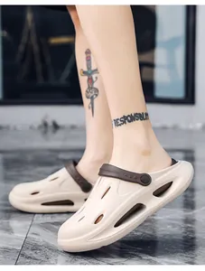 Detail of beige EVA clogs with adjustable brown heel strap and side ventilation ports
