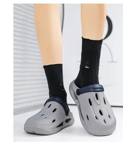 Close-up of lightweight grey EVA platform garden clogs with navy blue adjustable heel straps