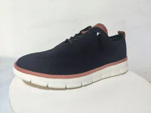 Detailed side view of breathable black mesh men loafers with white non-slip thick soles