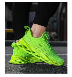 Detail view of neon green breathable mesh fashion sneakers with cushioned wave soles