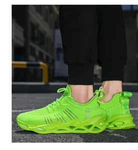 Close-up of fluorescent green breathable knit sneakers with a hollow blade cushioned sole