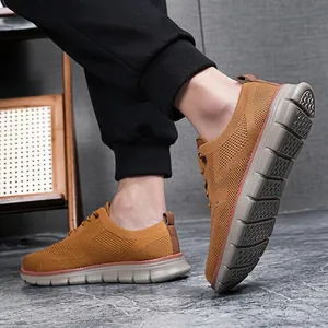 Detailed side view of men's breathable brown knit loafers with thick non-slip soles