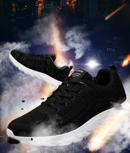 Detail of breathable black knit mesh upper and thick white anti-slip sole on men's running shoe