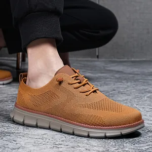 Detail view of breathable knit fabric and elastic lace system on tan men loafers
