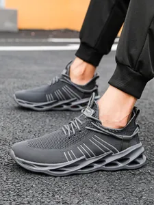 Macro detail of breathable knit mesh upper and hollow cushioned sole on grey sneakers